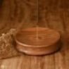 A wooden incense holder for aromatic sticks, perfect for home decor and creating a calming atmospher.