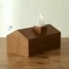 Wooden tissue dispenser for hotel or home decor, stylish and functional tissue holder.