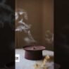 Aromatic wood incense stand for house, wooden home decor holder with smoke rising, stylish and funct.