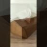 Wooden tissue dispenser for hotel or home decor, stylish and functional tissue holder.