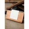 Wooden desktop calendar with minimalist design, perfect for home or office decor.