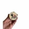 Hand holding a wooden Sindoor box, traditional Indian home decor accessory.