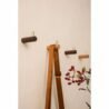 Wall hooks with wooden finishes for hanging accessories and decor.