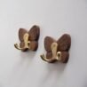 Elegant butterfly wall hooks with wooden wings and gold hooks for stylish organisation.