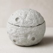 Create a new 4_5 portrait ecommerce product image of the grey concrete moon jar, preserving the exact product design and texture from the references.
